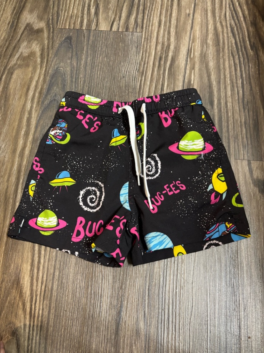 Bucces Boy toddler Black Space Print Swim Shorts with Neon Planets